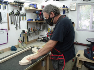Davy C working with one of his harp creations